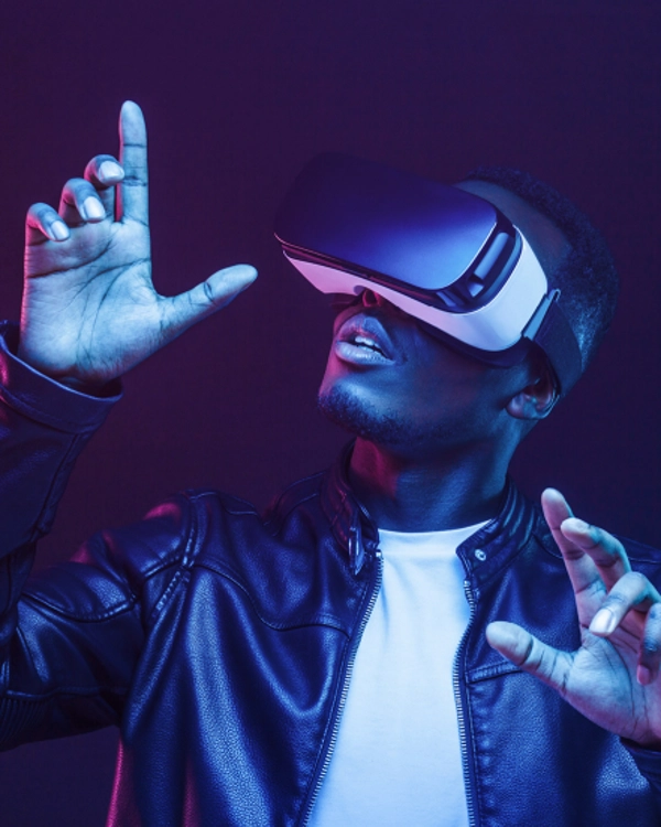 A man in leather jacket wearing a VR set 