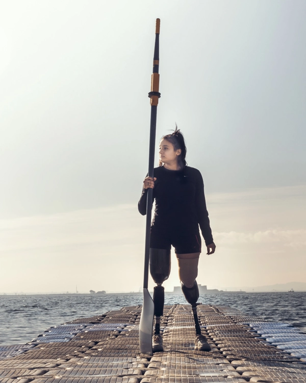 A disabled girl is doing sea kayak to demonstrate Allianz's social inclusion