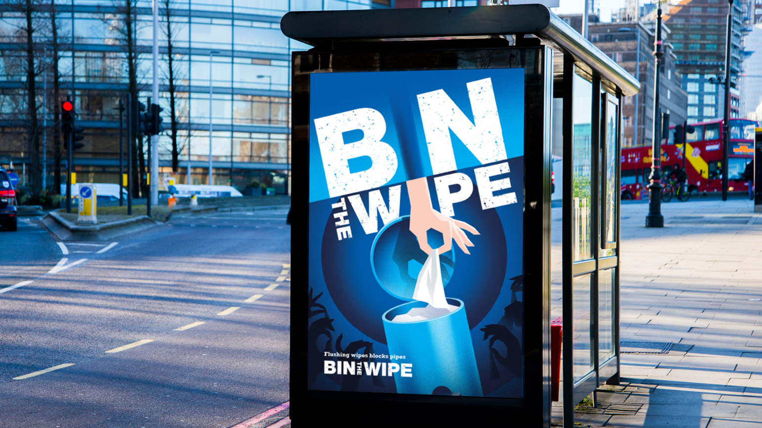 The mock-up of banner at a bus stop with a hand putting wipes in the bin 