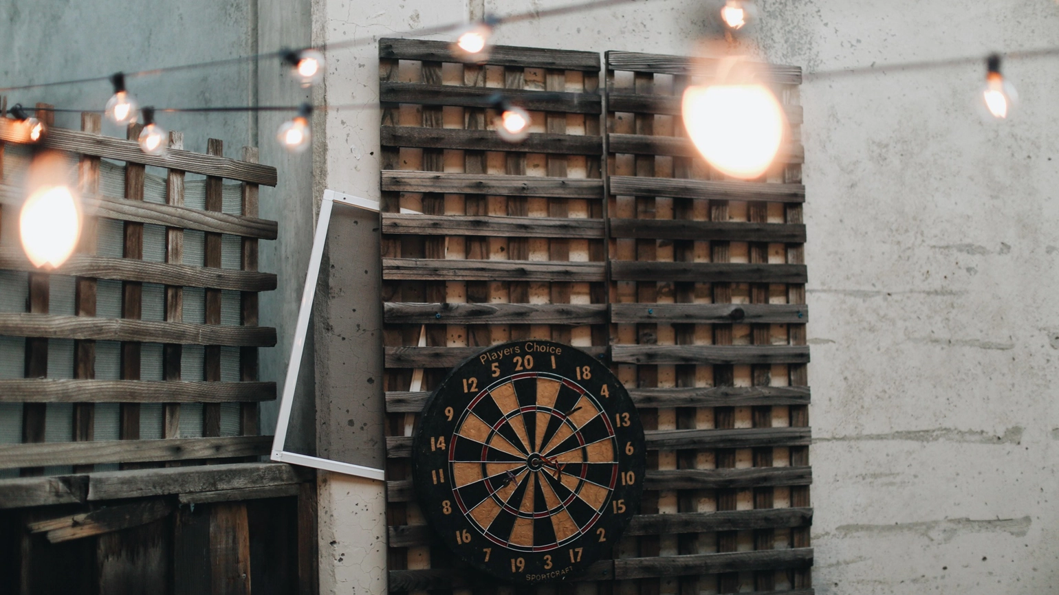 A dart board being hang on the wall